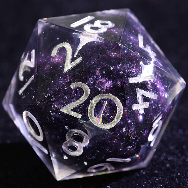 Close-up of a transparent D20 with a dark violet-black glittering centre and silver-coloured numbers.