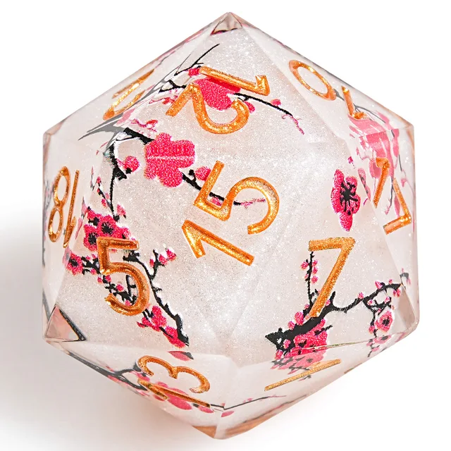 Close-up of a blossom-patterned D20 with gold numerals.