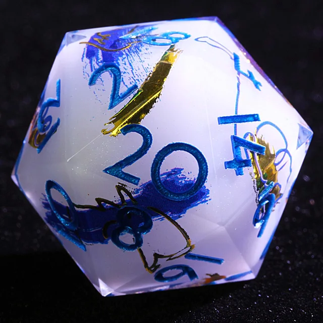 Close-up of a pearl-white D20 with blue numerals and blue-purple and gold brushstrokes.