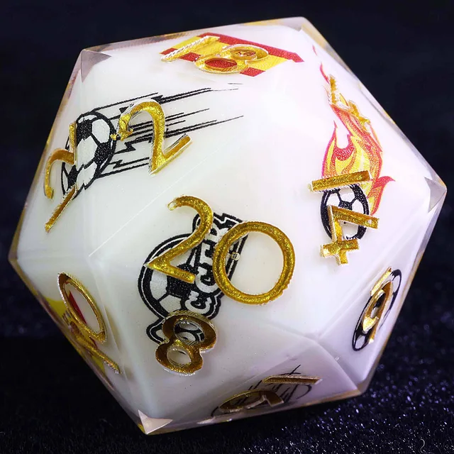 Close-up of a white Spain soccer D20 with gold numbers and soccer graphics.
