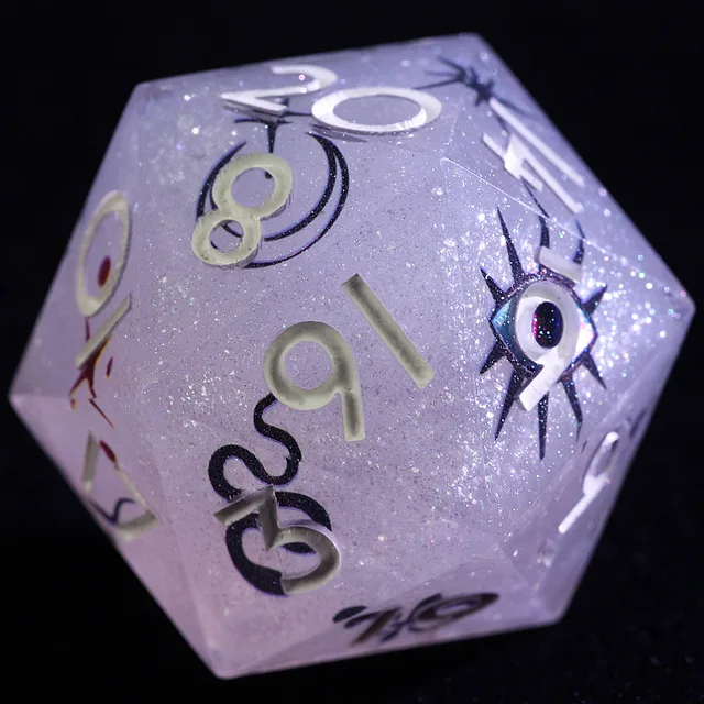 Close-up of a pale lavender glitter D20 with pale numerals and a blue eye design.