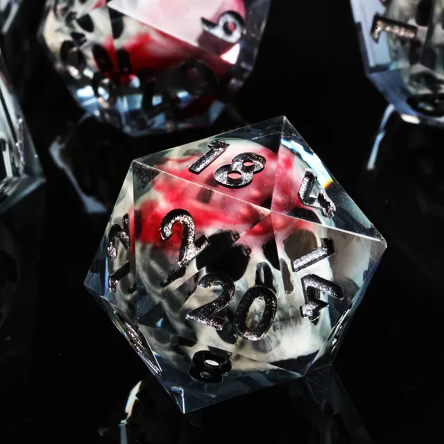 Close-up of a skull D20 with silver-coloured numerals.