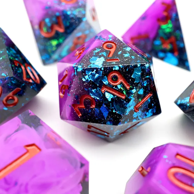 Close-up of a twenty-sided die with purple swirls, blue reflective flakes and copper-coloured numbers.