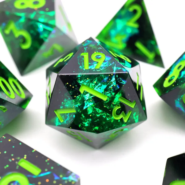 Close-up of green D20 with lime numbers and reflective flecks