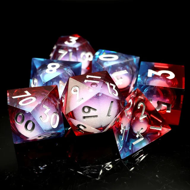 Seven red and blue liquid-core dice arranged on a black surface.
