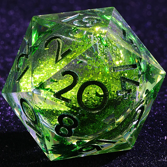 Close-up of a clear green D20 with a glitter-filled core and dark numerals.