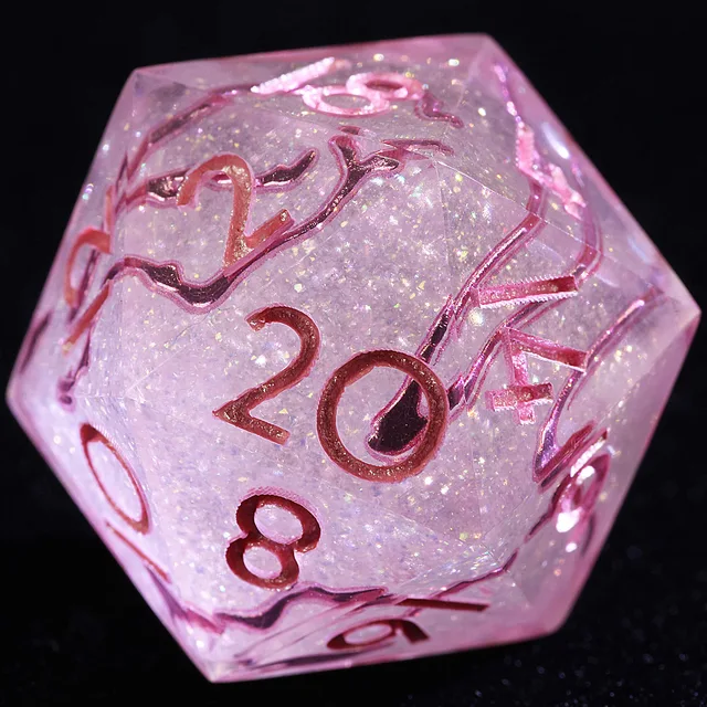 Close-up of a translucent pale pink glitter D20 with pink numbers and winding veins.