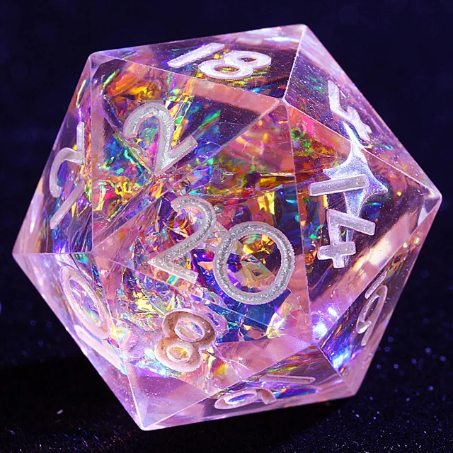 Close-up of a pale pink translucent D20 with iridescent inclusions and silver-coloured numbers.