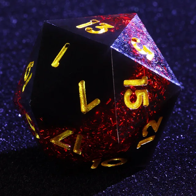 D20 with red glitter inclusions, dark faces and gold-coloured numbers.