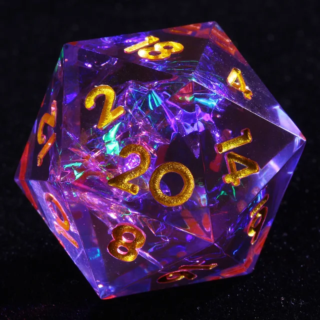 Close-up of a translucent blue-red D20 with gold numerals and wispy inclusions on black.