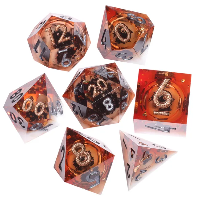 Seven amber-orange and white sharp-edged dice with dark flecks on a white background.