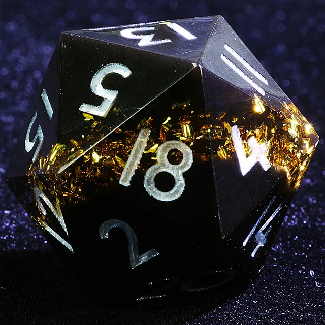 Assorted resin polyhedral dice from the Abyssal Gold set.