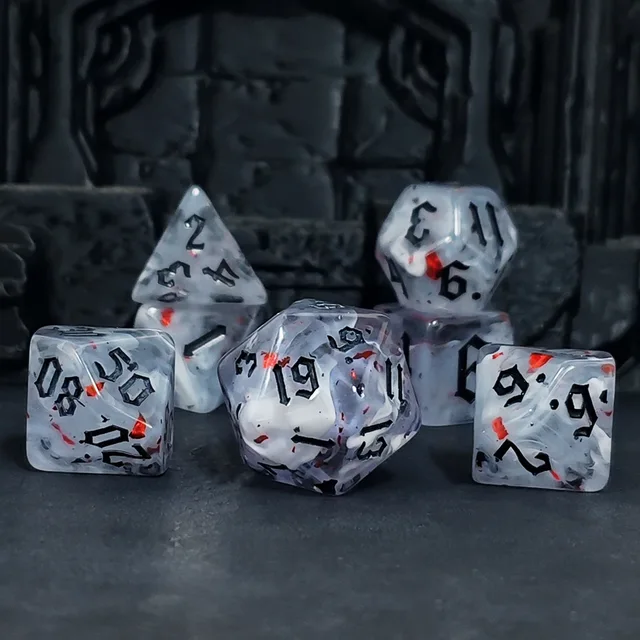 Translucent polyhedral dice with cloudy white swirls, scattered red and dark flecks, and black angular numerals.