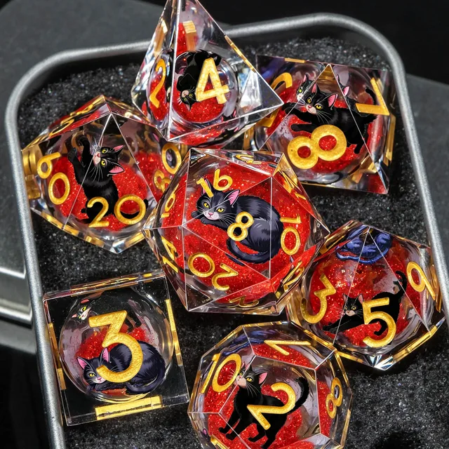 Polyhedral dice on a black playmat.