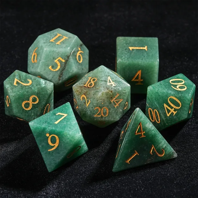 Faceted polyhedral dice in mottled green with cloudy patches, dark veining and gold-coloured numbers.